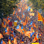 People hold  Catalan separatist flags known as “Esteladas” during a gathering to mark the Calatalonia day “Diada” in central Barcelona